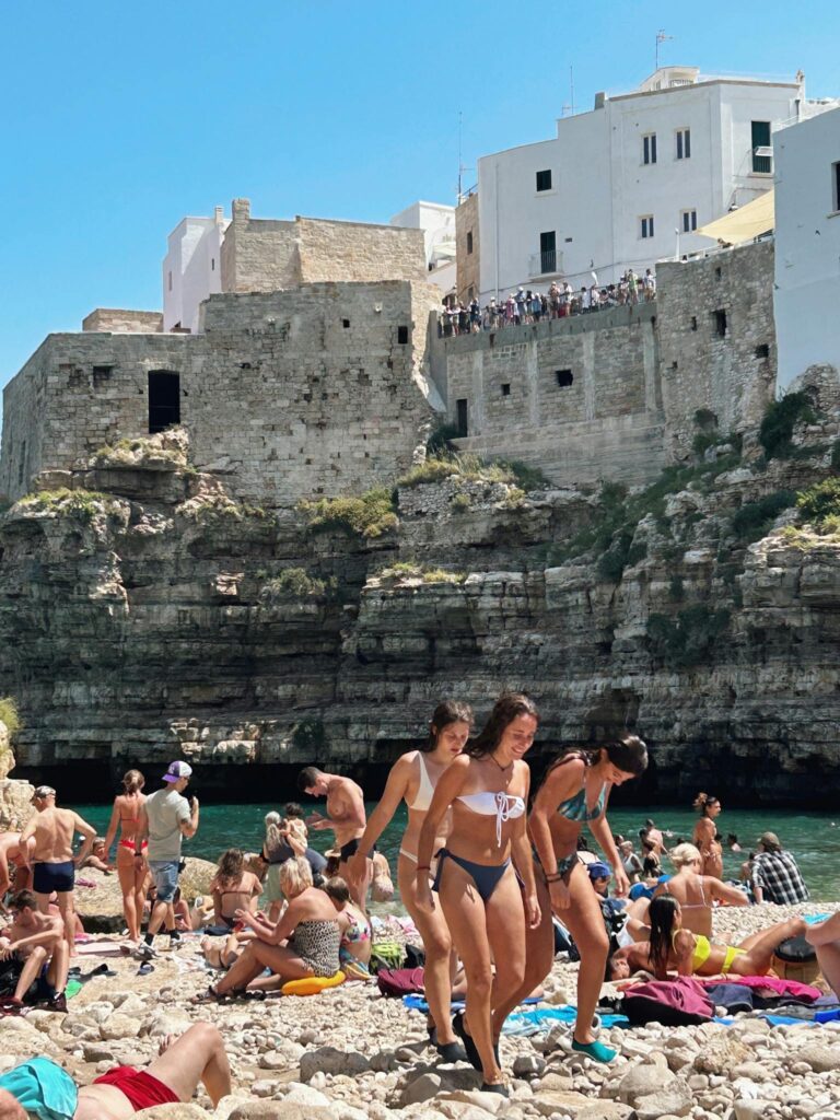 People on a Beach with a View of a Castle 