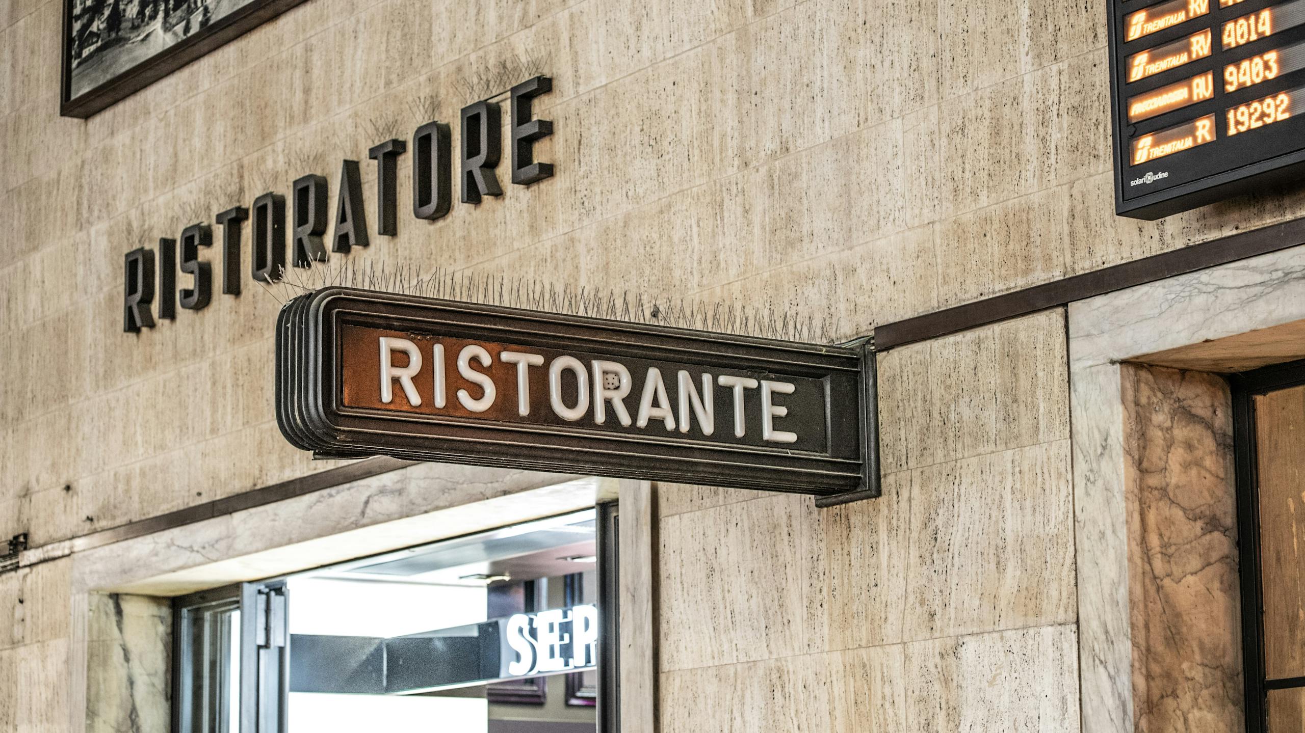 A vintage'Ristorante' sign at a train station in Florence, Tuscany, Italy, captures local charm.